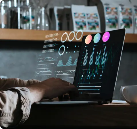 A man's hands using a laptop