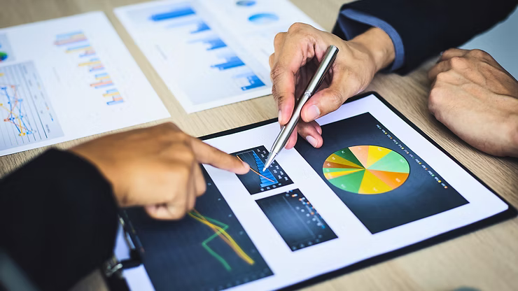 A budget planning meeting going over some charts